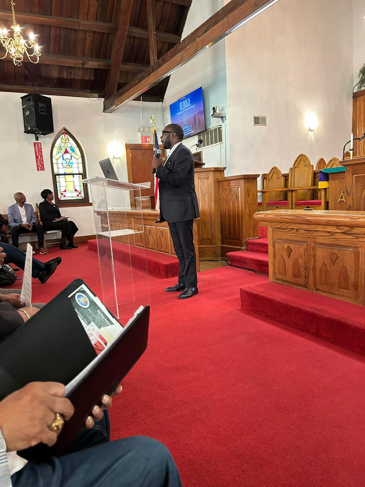 Dr. Jonathan Lotson teaching in a church